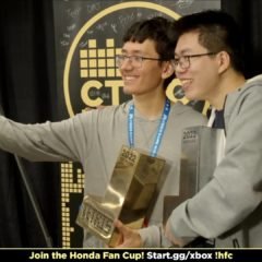 EricICX and Fractal take a Selfie, while holding their trophies.