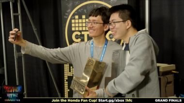 EricICX and Fractal take a Selfie, while holding their trophies.