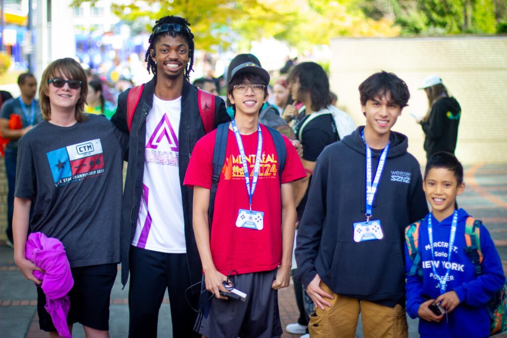 Blue Scuti, Sharky, PixelAndy, Dog, and Zrobot (the new Tetris prodigy), pose for a photo outside the expo after a fire alarm evacuation